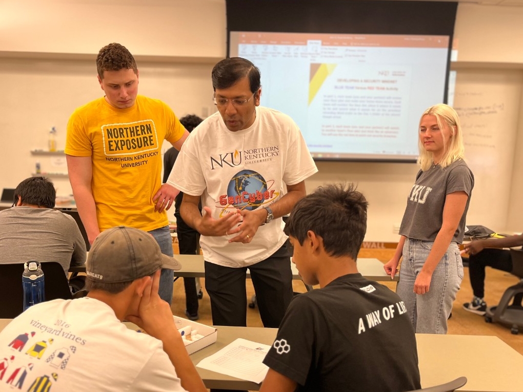 NKU STEM majors help guide teens through activities during a STEM Summer Academy tNKU faculty, students, and community partners guiding high school-aged teens during Beginners' Cybersecurity Academy.