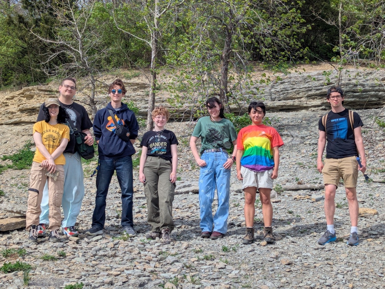 Geology Club members take a group photo outside on their fossil field trip.