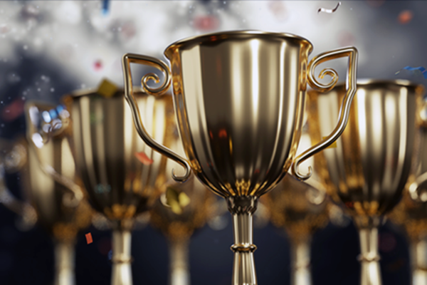 close up golden trophy award with falling confetti. copy space for text. 3d rendering. Trohpy Award cups