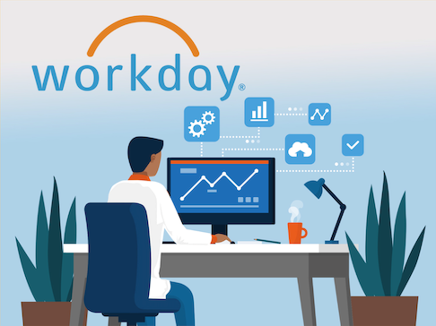 A user sitting at a computer using Workday.